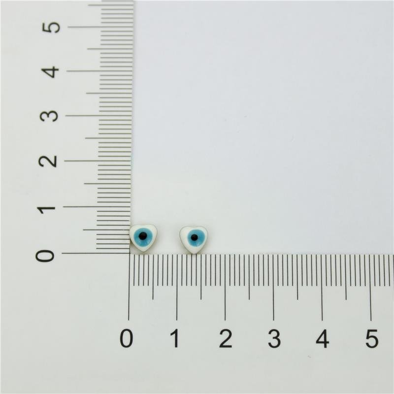 BRINCO FORTUNATO CORAÇÃO DE OLHO GREGO BRANCO NO BRUTO